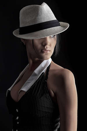 Shot of an attractive young woman in sexual lingerie, over black background.の写真素材