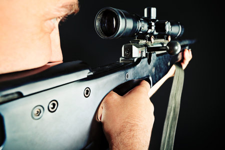 Shot of a conceptual soldier painted in khaki colors. Over black background.