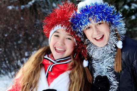 Happy children having fun outdoor on winter.の写真素材