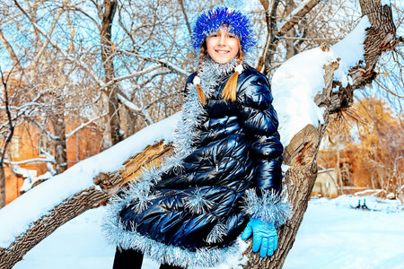Cute girl at a winter park. 