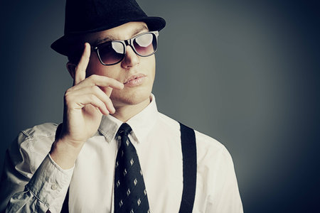 Portrait of a handsome young man in a suit. Shot in a studio.