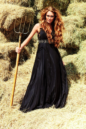 Charming woman witch at a countryside.の写真素材