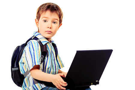 Shot of a boy with his laptop. Isolated over white background.
