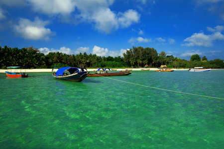 Picturesque tropical beach, traditional long tail boats, Andaman Sea. 