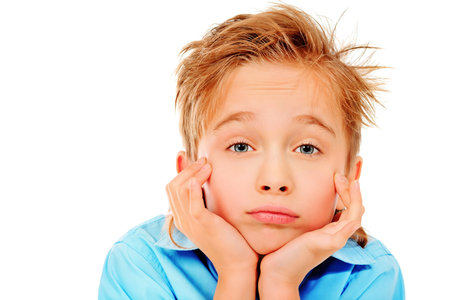 Portrait of a 8 year boy. Isolated over white background.