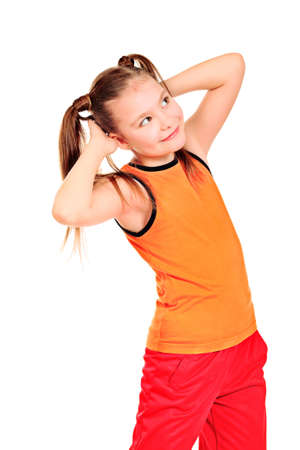 Shot of a sporty girl making exercise  Isolated over white background の写真素材