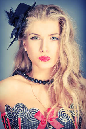 Portrait of a charming blonde woman posing in studio.の写真素材