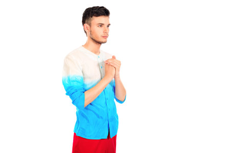 Portrait of a handsome fashionable man posing at studio. Isolated over white.