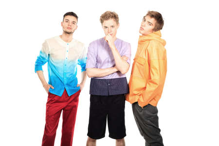 Group of handsome fashionable men posing at studio. Isolated over white.の写真素材