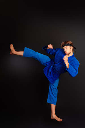 Martial arts fighter posing at studio.の写真素材