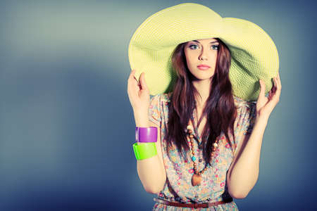 Shot of a beautiful girl in summer style posing at studio.の写真素材