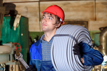 Industry: a worker at a manufacturing area.