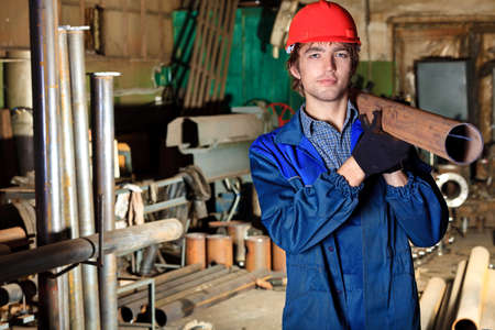 Industry: a worker at a manufacturing area.の写真素材