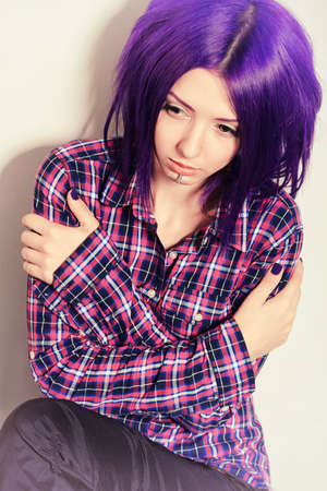Portrait of a punk girl with purple hair. の写真素材