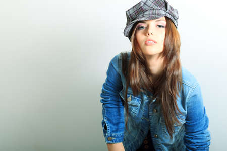 Shot of an attractive fashionable girl posing in studio.の写真素材