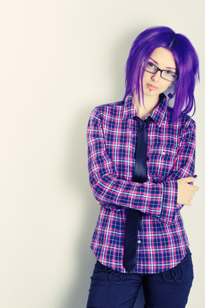 Portrait of a punk girl with purple hair. の写真素材
