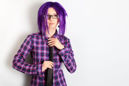 Portrait of a punk girl with purple hair. 