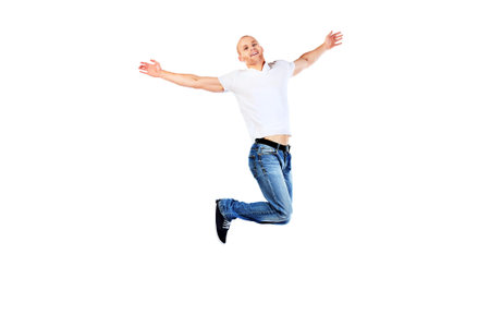 Portrait of a happy jumping man. Isolated over white.