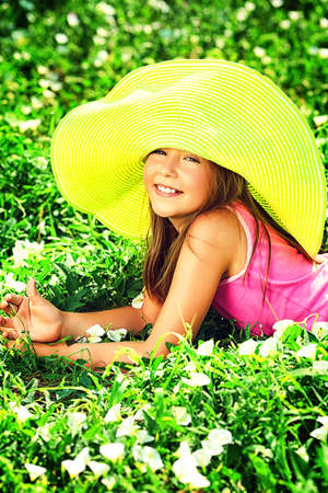 Happy summer girl having fun outdoors.の写真素材