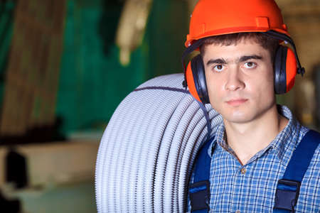 Industry: a worker at a manufacturing area.の写真素材