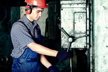 Industry: a worker at a manufacturing area.