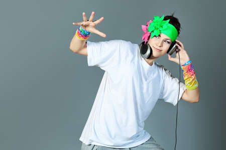 Trendy girl in headphones dancing on disco.の写真素材