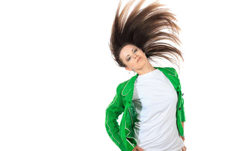 Modern girl dancing hip-hop at studio. Isolated over white.の写真素材