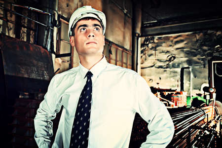 Industrial theme: businessman at a manufacturing area.の写真素材