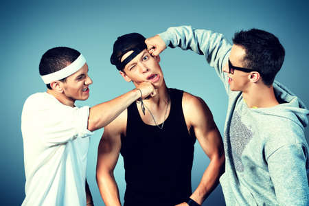 Group of modern dancers dancing hip-hop at studio.の写真素材