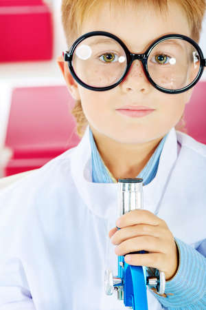 Cute boy is making science experiments in a laboratory. Education.の写真素材