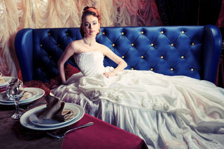 Beautiful bride in a luxurious restaurant. Vintage style.の写真素材