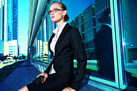 Young business woman in the big city purposefully looking away.の写真素材