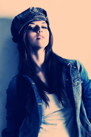 Shot of an attractive fashionable girl posing in studio.の写真素材