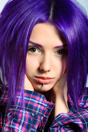 Portrait of a punk girl with purple hair. の写真素材