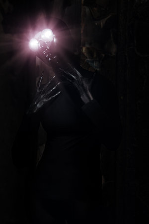 Scary alien creature in an abandoned house. Halloween, horror.
