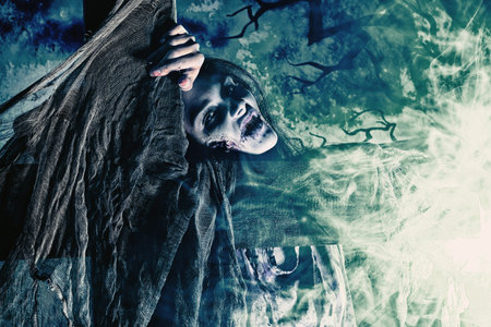 Bloodthirsty zombi standing at the night cemetery in the mist and moonlight.