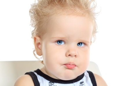 Portrait of a lovely baby boy. Isolated over white background.