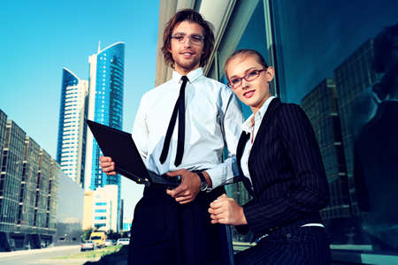 Business people are talking together in the big city.の写真素材