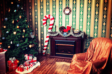 Christmas home decoration with tree, gifts and fireplace.
