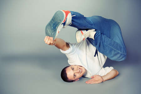 Trendy young man dancing hip-hop at studio.の写真素材