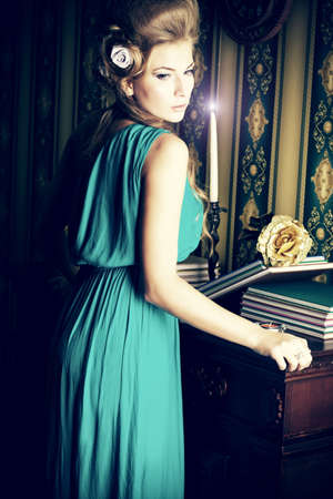 Beautiful romantic lady posing in the  vintage interior.の写真素材