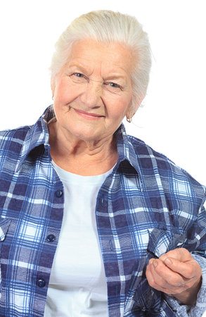 Happy senior woman smiling at the camera. Isolated over white.