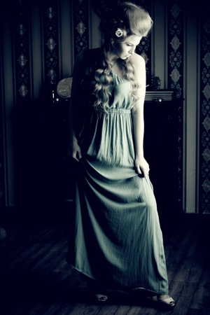 Beautiful romantic lady posing in the  vintage interior.の写真素材