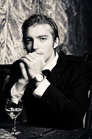 Portrait of a handsome groom on his wedding celebration.
