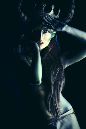 Beautiful and scary devil woman. Art project.の写真素材