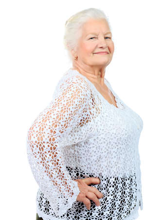 Happy senior woman smiling at the camera. Isolated over white.の写真素材