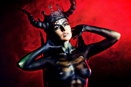 Beautiful and scary devil woman. Art project.