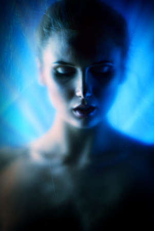 Vague silhouette of a beautiful naked woman. の写真素材