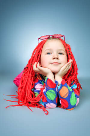 Portrait of a cute little girl wearing modern braids and clothes.の写真素材