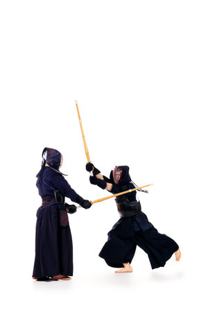 Two kendo fighters are fighting with each other. Asian martial arts.の写真素材